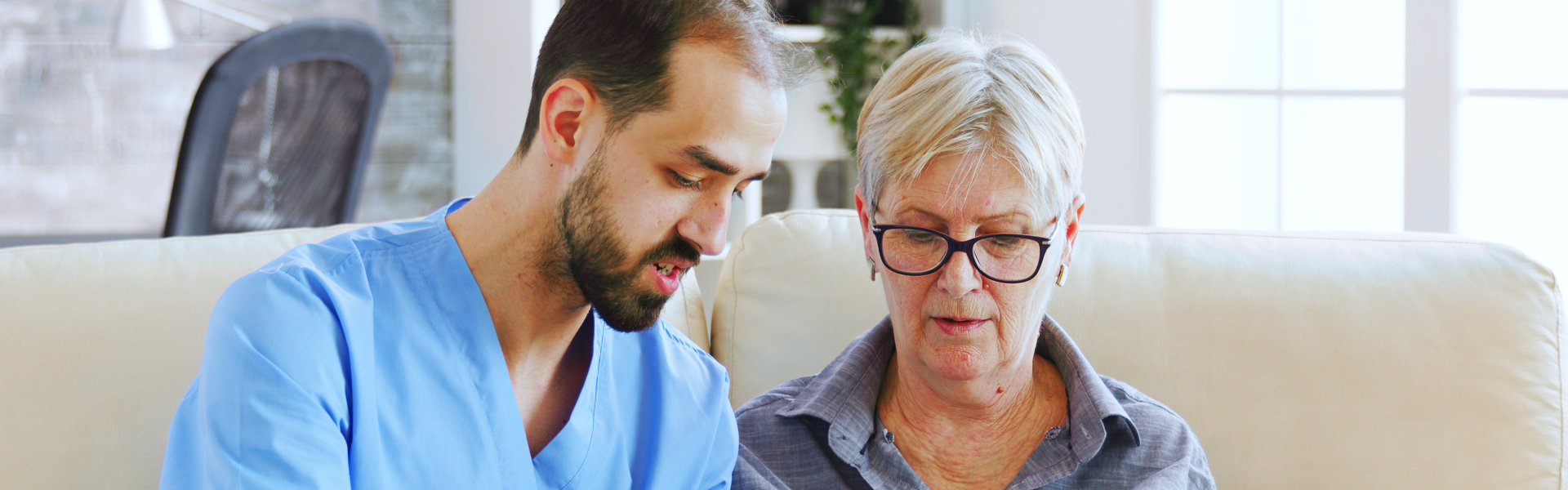 Elderly woman and male nurse